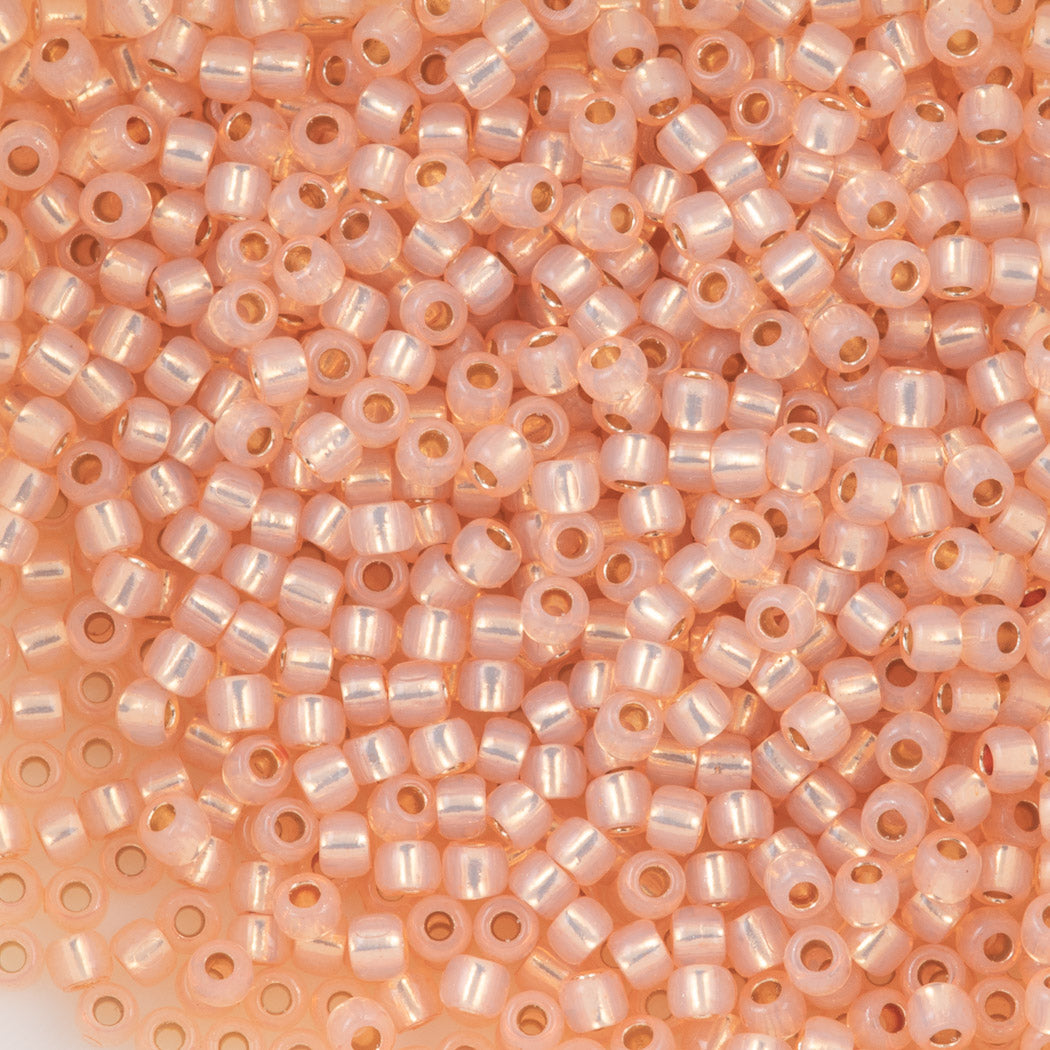 Toho Round Seed Bead 11/0 PermaFinish Silver Line Milky Peach (2111PF)
