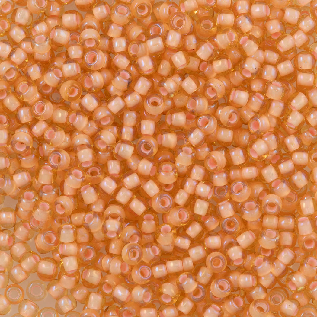 Toho Round Seed Bead 11/0 Light Topaz Inside Color Lined Peach (301)