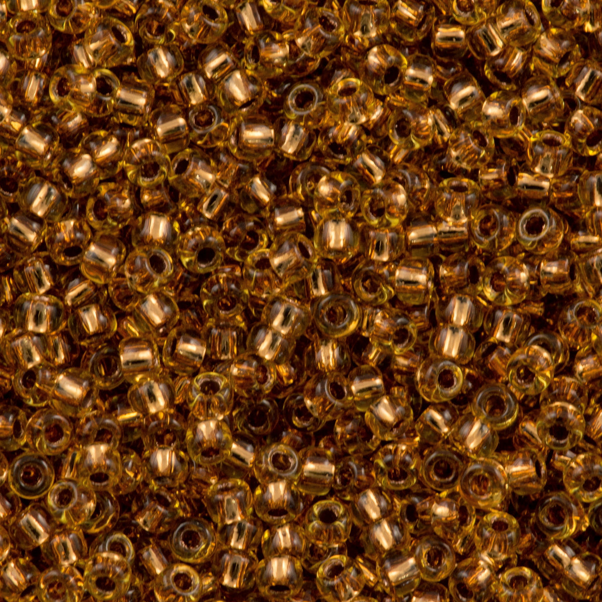 50g Toho Round Seed Bead 11/0 Copper Lined Light Topaz (744)