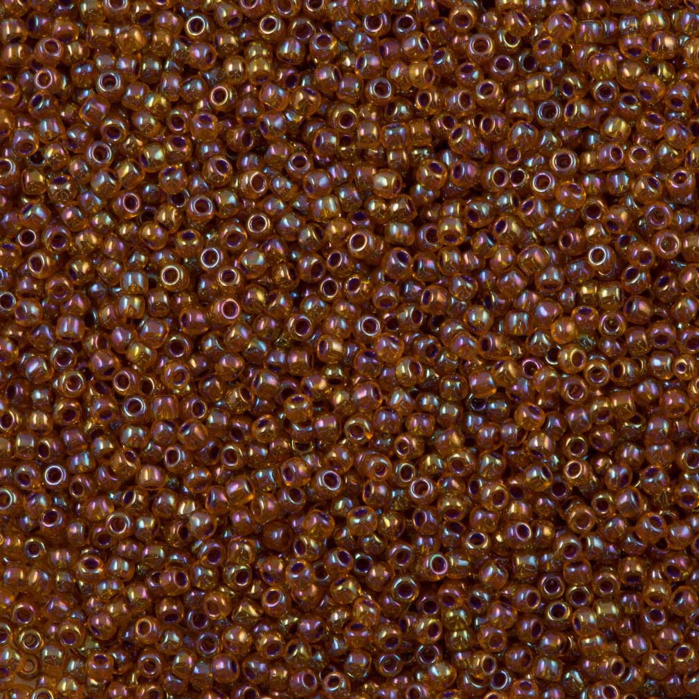 50g Toho Round Seed Beads 11/0 Purple Lined Ruby AB (1825)