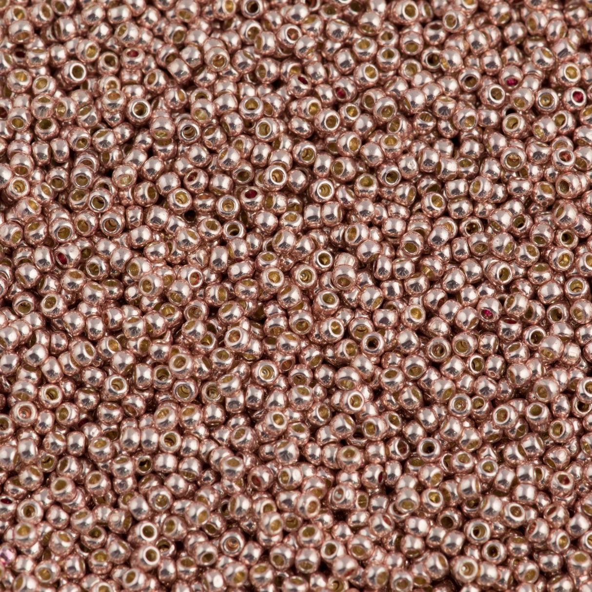 50g Toho Round Seed Bead 11/0 Permanent Finish Galvanized Peach Coral (552PF)