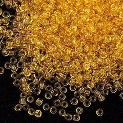 Toho Round Seed Beads 6/0 Transparent Amber 5.5-inch tube (2)