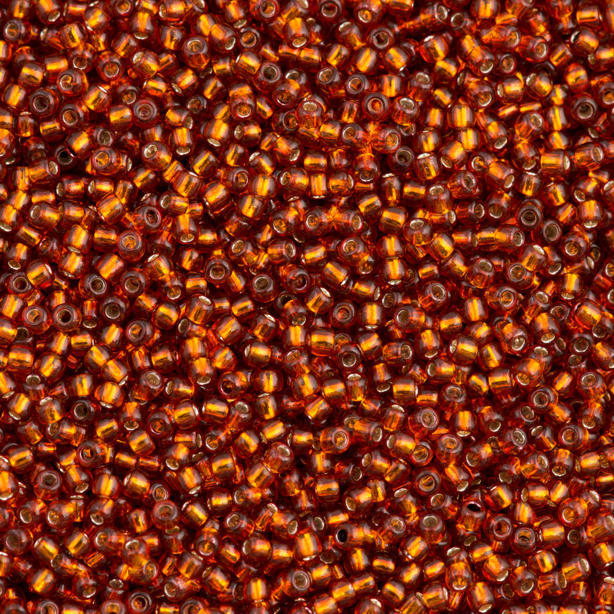 50g Toho Round Seed Bead 11/0 Silver Lined Burnt Orange (2208)