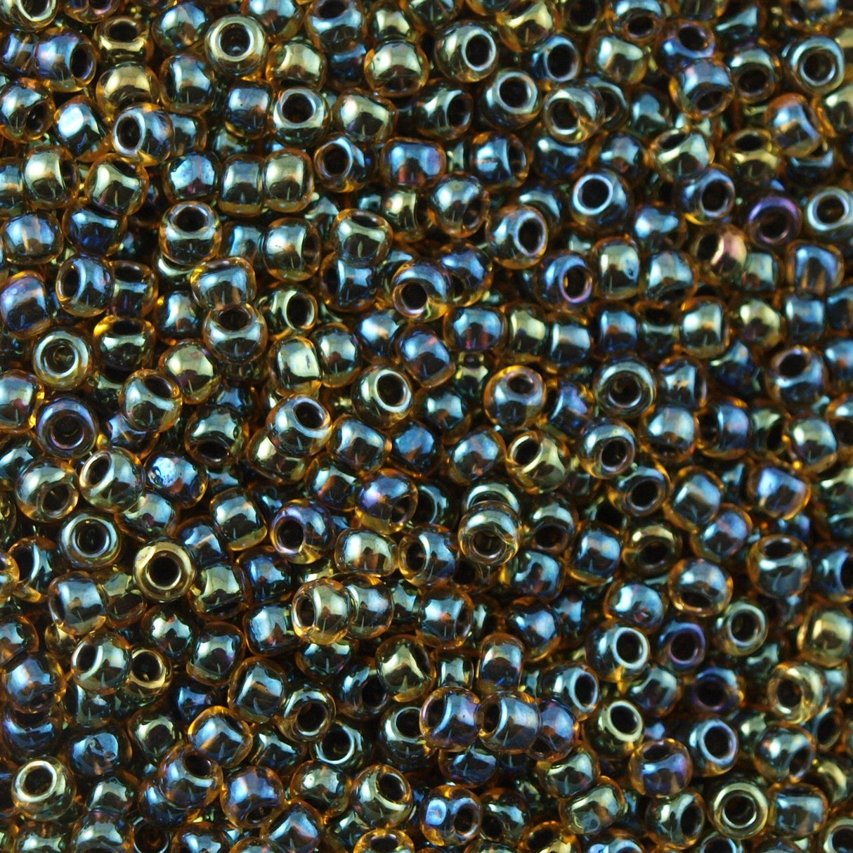 50g Toho Round Seed Beads 11/0 Inside Color Lined Midnite Amber (244)
