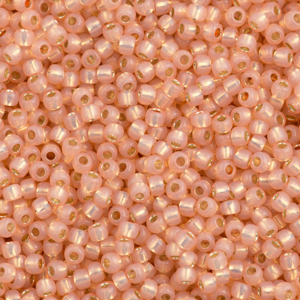 Toho Round Seed Beads 6/0 Silver Lined Milky Peach (2111)