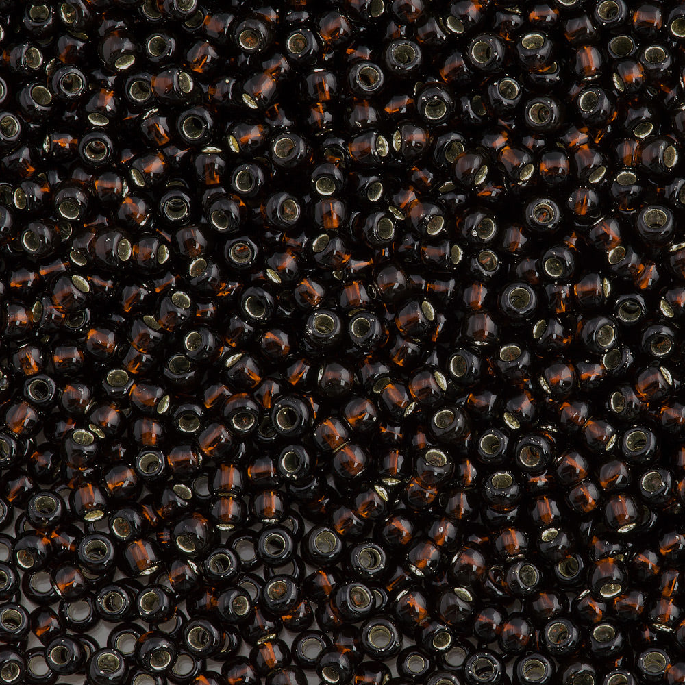 50g Toho Round Seed Bead 8/0 Silver Lined Root Beer (2205)