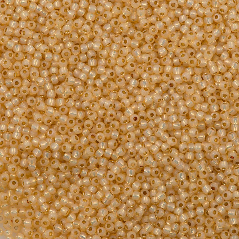 50g Toho Round Seed Bead 11/0 Permanent Finish Silver Lined Milky Light Topaz (2110PF)