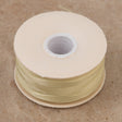 Size D Nymo Nylon Cream Thread bobbin