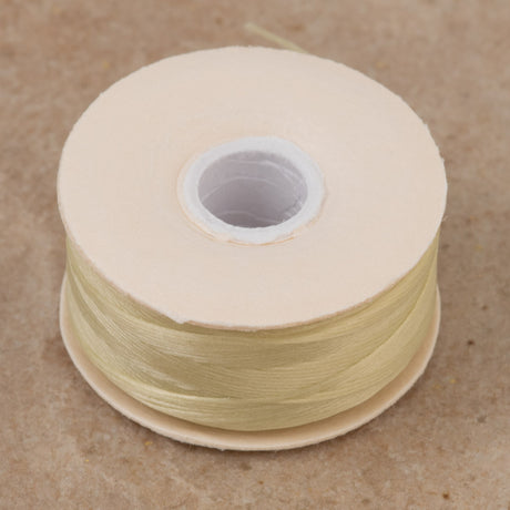 Size D Nymo Nylon Cream Thread bobbin