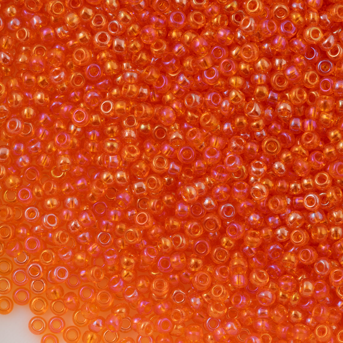 Czech Seed Bead 10/0 Transparent Orange Iris (91030)