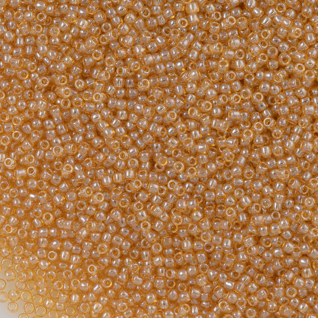 50g Toho Round Seed Bead 11/0 Transparent Light Topaz Luster (103)