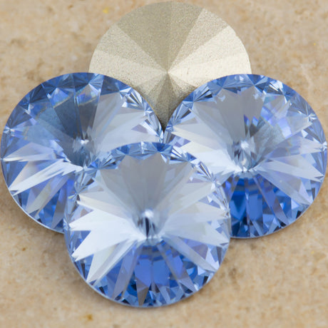 Four TRUE CRYSTAL 12mm Rivoli Light Sapphire (211)