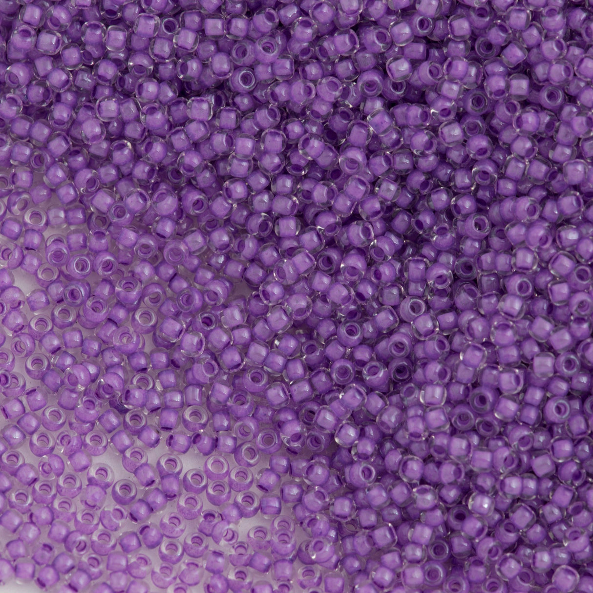 50g toho Round Seed Bead 8/0 Inside Color Lined Wisteria (935)