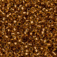 50g Toho Round Seed Bead 11/0 Copper Lined Light Topaz (744)