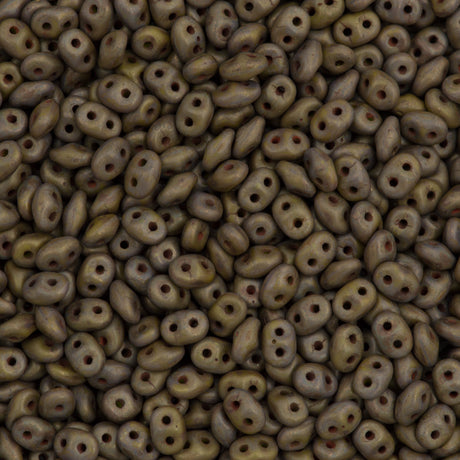 A close-up of small, opaque, two-hole Super Duo beads in an olive copper picasso finish.