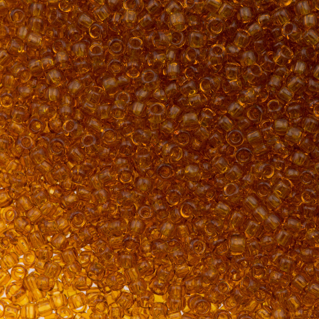 Toho Round Seed Bead 11/0 Transparent Dark Amber 19g Tube (2C)