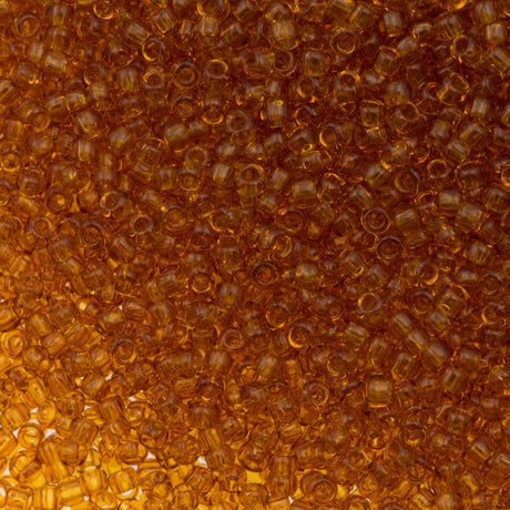 50g Toho Round Seed Bead 11/0 Transparent Dark Amber (2C)