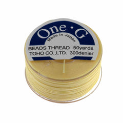 Toho One-G Nylon Light Yellow Thread 50 yard bobbin