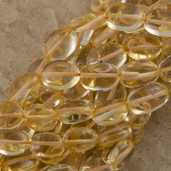 Citrine 9x7mm flat oval beads 16" strand