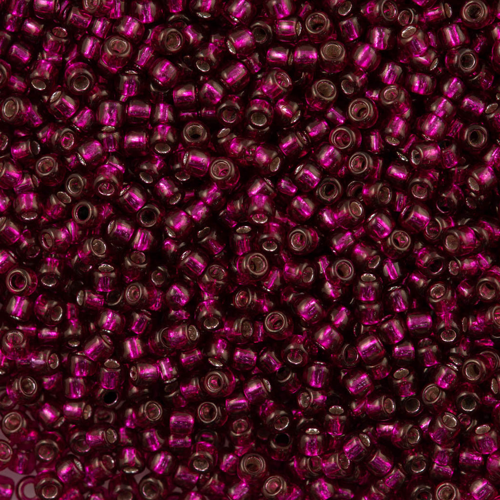 50g Toho Round Seed Bead 8/0 Silver Lined Dragonfruit (2223)