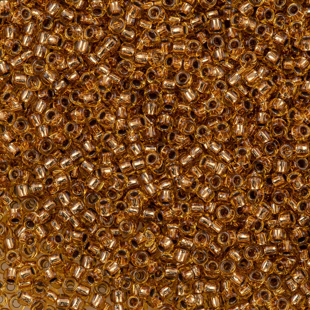 50g Toho Round Seed Bead 8/0 Copper Lined Light Topaz (744)