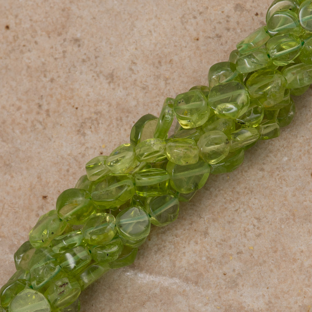 Peridot 4-5mm Coin beads 16" Strand