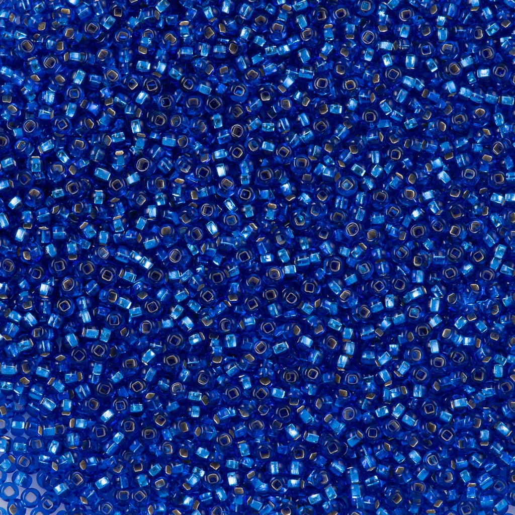 Czech Seed Bead 11/0 Transparent Sapphire Silver Lined (37050)