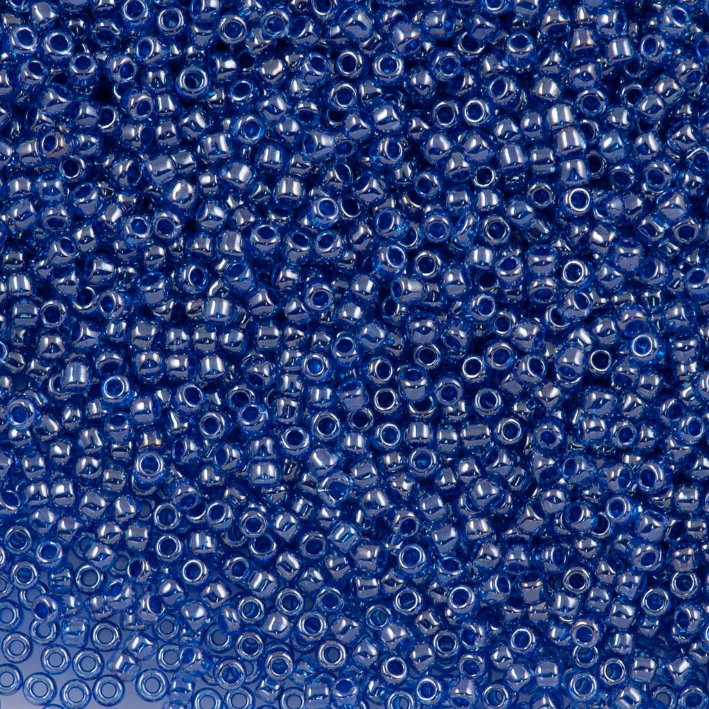 50g Toho Round Seed Bead 11/0 Light Sapphire Inside Color Lined Dark Blue (1057)