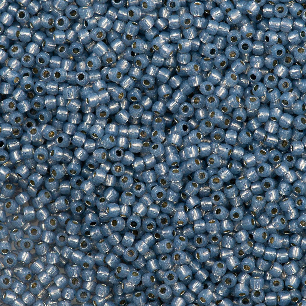 50g Toho Round Seed Bead 11/0 Permanent Finish Silver Lined Milky Montana Blue (2102PF)