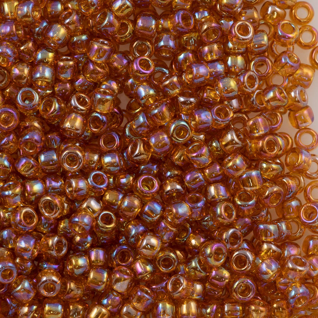 50g Toho Round Seed Bead 11/0 Transparent Dark Amber AB (162C)