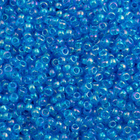 50g toho Round Seed Bead 8/0 Transparent Dark Caribbean AB (163B)